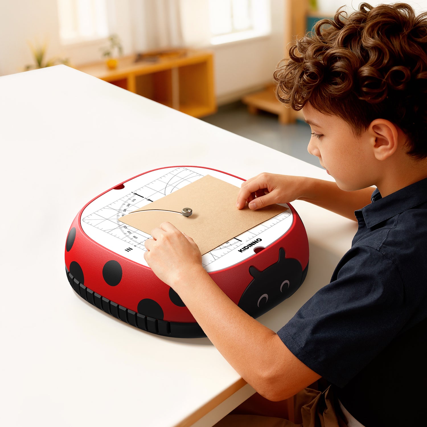 Child using the Kidinno cardboard cutting tool to cut cardboard shapes for a creative DIY craft project.